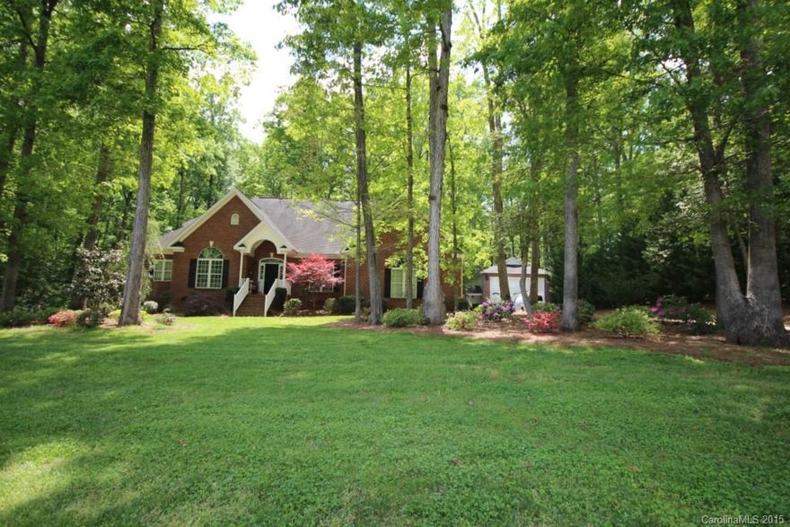 IMMACULATE ALL BRICK HOME, TWO CAR ATTACHED GARAGE WITH STORAGE ROOM!  UPDATED BATHS, CHEF'S KITCHEN, TRAVERTINE AND WOOD FLOORS, MASTER ON MAIN, SUN ROOM, STUDY, MEDIA OR GAME ROOM, HUGE SCREEN PORCH, LARGE PRIVATE DECK AND WOODED YARD. 1.2 ACRES AND CLOSE TO LAKE WYLIE WITH AN EXTRA 25 X 50 RV GARAGE, PERFECT FOR COLLECTOR CARS, BOATS, OR WORKSHOP WITH 50 AMP POWER OUTLET AND ITS OWN ELECTRIC SERVICE.  COMES COMPLETELY FINISHED INSIDE.