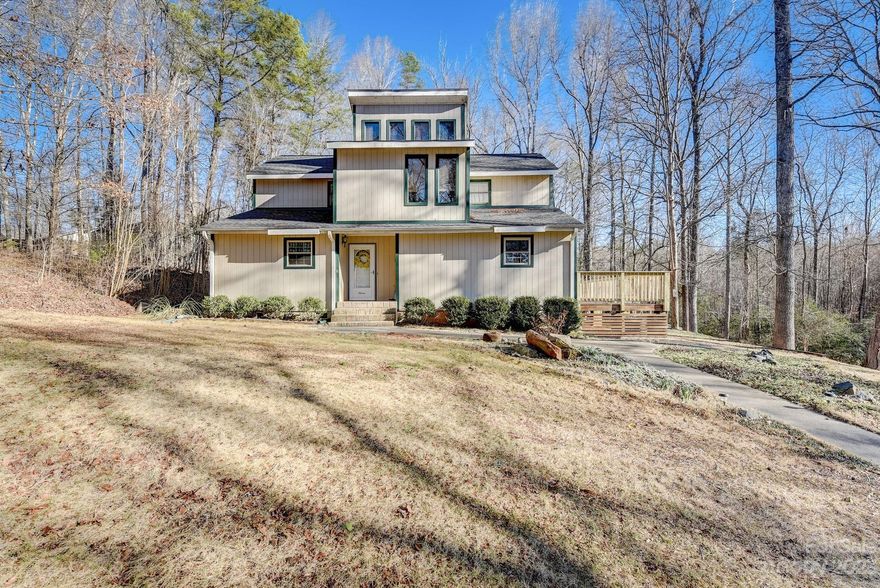 Beautiful contemporary home on 1.4 acres less than 5 minutes from Ballantyne with low SC taxes. Enjoy this scenic setting on your large deck overlooking beautiful, private land. There is a large detached garage that fits two cars and a workshop.Hardwood floors in the living room and dining room.  Vaulted great room with stone fireplace.  The second floor has two bedrooms and a loft along with extra space on the third floor loft that is currently used as storage but would be great as a library or a playroom. You will love living here! The seller just had new insulation and vapor barrier in the crawlspace with a transferable warranty. The sellers have received multiple offers and are asking for highest and best by 1pm on Wednesday January 31.