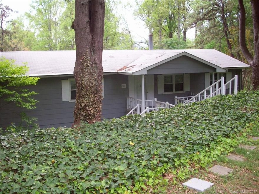 This beautiful 4/2 on three Lake Junaluska lots needs some repairs and updates an AS IS STEAL, A GIVE AWAY! No Lake service charge! Three lots afford privacy, greenhouse and outside storage building. Basement finished into a 2nd living quarters & can be accessed form main floor to give tremendous interior space. There are solar panels on the roof to supplement energy use, a workshop, and sun room on the upper level. Includes lots 8617820392, 8617821380. SCREAMING OPPORTUNITY HERE!!