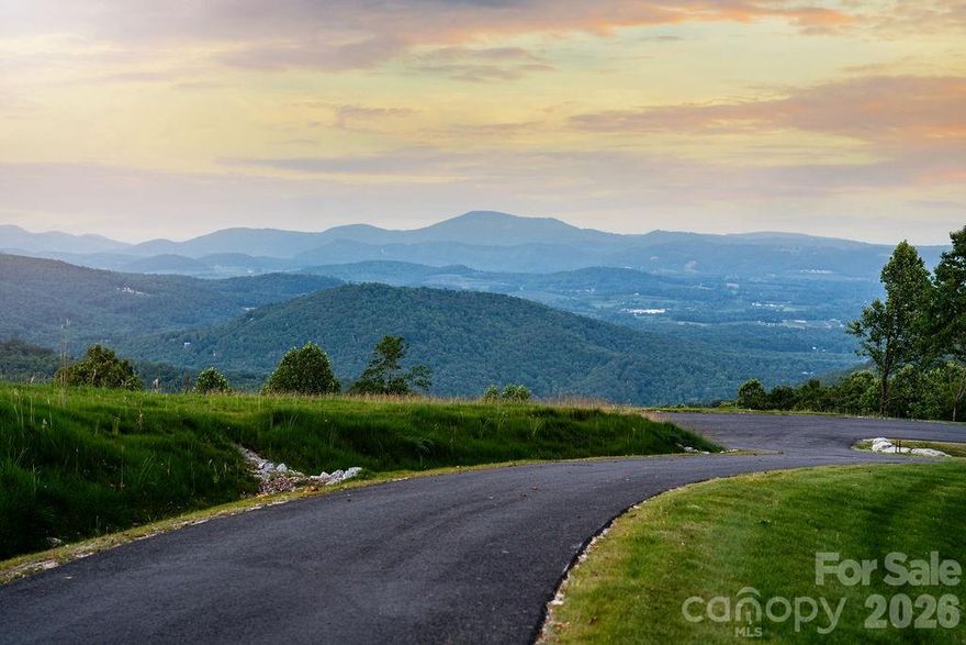 Discover sweeping, panoramic views of the Blue Ridge Mountains from every direction at Homesite 26 in Sprout. Perched at the summit, this exceptional 2.5-acre homesite offers the perfect setting for your mountain retreat. With a desirable south/southwest orientation, you’ll enjoy vibrant, long-lasting sunsets from your back deck and peaceful, misty sunrises from your front porch each morning. The generous acreage provides a true sense of privacy, all within a thoughtfully designed gated community.
Sprout is a 375+ acre conservation-focused community ideally located just south of Asheville and north of Hendersonville, only 20 minutes from Asheville Regional Airport and 15 minutes from downtown Hendersonville. Residents enjoy over 5 miles of professionally maintained trails for hiking and mountain biking, along with opportunities to connect through three community gardens or explore beekeeping at two on-site apiaries. With 150 acres preserved in conservation, Sprout offers a harmonious blend of nature, community, and lifestyle, making Homesite 26 your perfect place to experience mountain serenity.