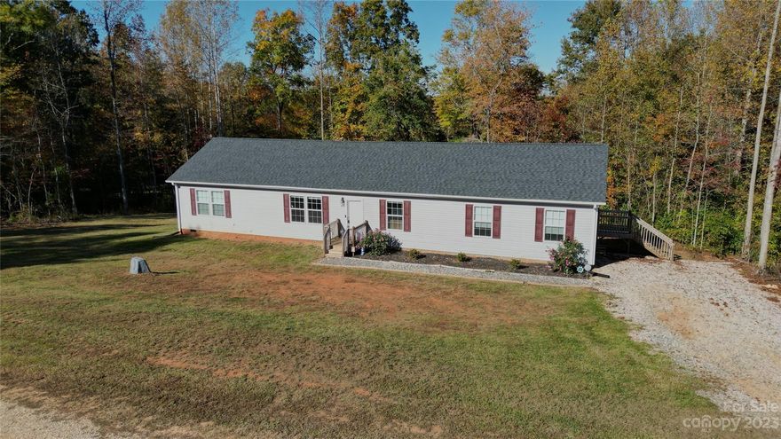 Nestled in the charming town of China Grove, North Carolina, this stunning 4-bedroom, 2-bathroom is a testament to modern comfort and style. Built in 2020, this off-frame modular home offers a perfect blend of contemporary design and peaceful countryside living. Situated on just over 1 acre of land, this property is a haven of space and tranquility.