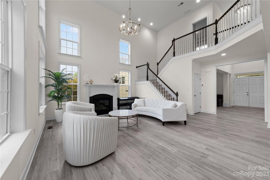 Stunning, brick front, Niblock home! Spacious lot on a cul-de-sac w/ no one behind you plus deck & vinyl privacy fence. Covered front porch w/ double door entry leads to the 2-story foyer. Formal dining & flex space (office/playroom/den), both w/ coffered ceilings, flank the foyer. 2-story family room w/ fireplace & wall of windows overlooking the yard. This opens to the breakfast & designer kitchen which is made for entertaining or every day living. 42" cabinets, quartz counters, upgraded stainless appliance package, subway tile backsplash & center island w/ breakfast bar. Large guest bedroom plus full bath located on main. Upstairs you'll find 3 secondary bedrooms, hall bath, laundry & HUGE primary suite! Primary boasts tray ceiling, crown molding, large closet that connects to laundry & ensuite bath w/ double door entry, soaking tub, his/hers vanities & tiled shower. Luxury vinyl through main, upgraded lighting & built-in speakers. Epoxy garage floor. Storage galore! WELCOME HOME!