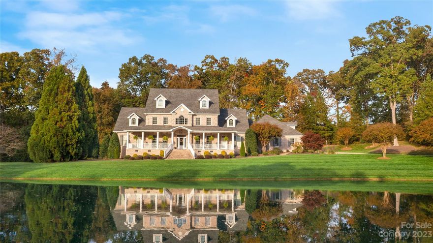 Welcome to this exquisite Custom French Country Home, a true masterpiece nestled on 6.63 acres of lush land. This residence presents a harmonious blend of architectural elegance and modern functionality. As you approach the property a sense of grandeur welcomes you. Stepping inside, you're greeted by a grand foyer that gracefully leads into the large living room perfect for gatherings and relaxation. The heart of the home lies in the gourmet kitchen, adorned with custom cabinetry. The primary en-suite is a true sanctuary, offering a spa-like retreat from the demands of everyday life. With a billiards room or staying fit in the well-appointed home gym the basement is well equipped.  The home overlooks a serene pond, this picturesque setting provides a private escape while still being a part of a welcoming community.  Relaxing on the screened-in deck with Ipe wood floors, where you can enjoy the beauty of the outdoors in comfort and style. Price adjustment to reflect increased sq footage