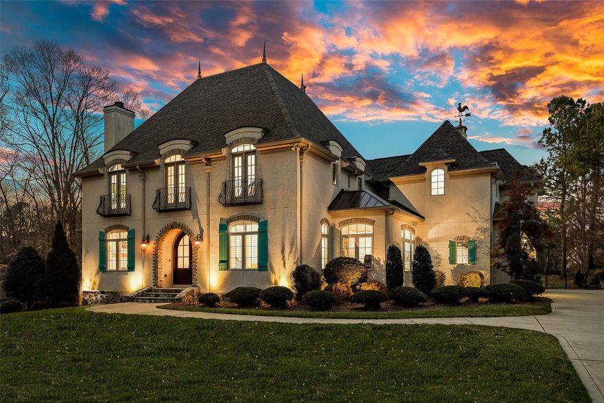 STUNNING French Provincial estate nestled on large waterfront lot w/ heated saltwater pool! BRAND NEW roof Oct '22!  This home has it all! Upon entering the home you will find a living room and fireplace to your left w/ formal dining room on your right. Large beautiful windows allow for plenty of natural light throughout! Continue to the kitchen and two story great room w/ a second fireplace. From here you will look out over the in ground pool and views of the neighborhood pond! Chef's kitchen is well-equipped w/ 6 burner Thermador gas cooktop, Pro refrigerator, reverse osmosis drinking water system, new dishwasher, and so much more! Large primary bed and bath allow access to patio/pool area on main level. Upstairs you will enjoy a large bonus room w/ built in cabinetry for work or school needs, 3 addl beds, & 3.5 baths. 3 car garage w/ electric vehicle charging station. Enjoy low SC taxes and convenient to the new Indian Land High School, Ballantyne, Waxhaw, shopping, and dining!