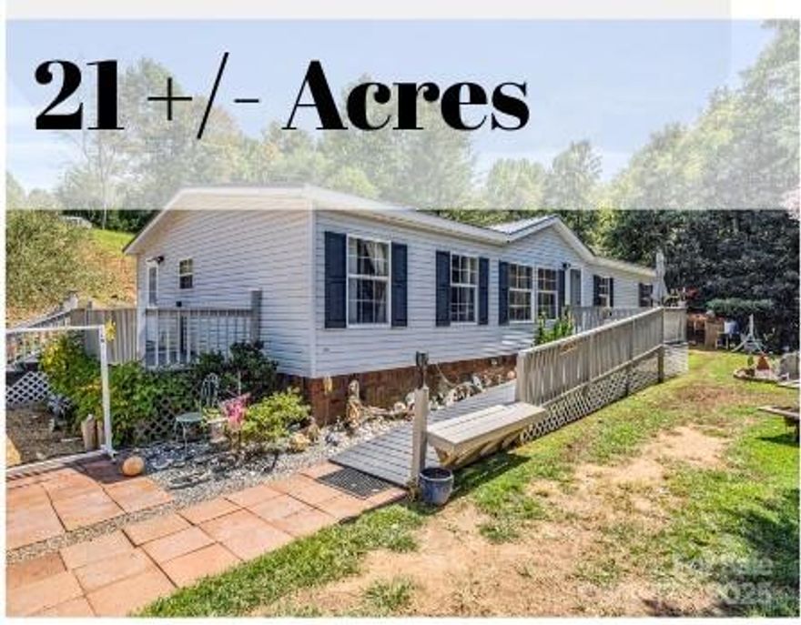 No restrictions on this property! 21+/- acres to be surveyed out at or shortly after closing. Three bed 2 bath DW is perfect for multi-generations. 2 Living room areas provides a place for separate functions. The long private gravel drive alongside a creek marking the property line. Multi uses whether for horses, pasture, gardening, multiple home sites or just enjoying peace and tranquility. There is a road maintenance agreement in place. Approximately 21 acres of the total 42-acre property will be surveyed out at or shortly after closing.