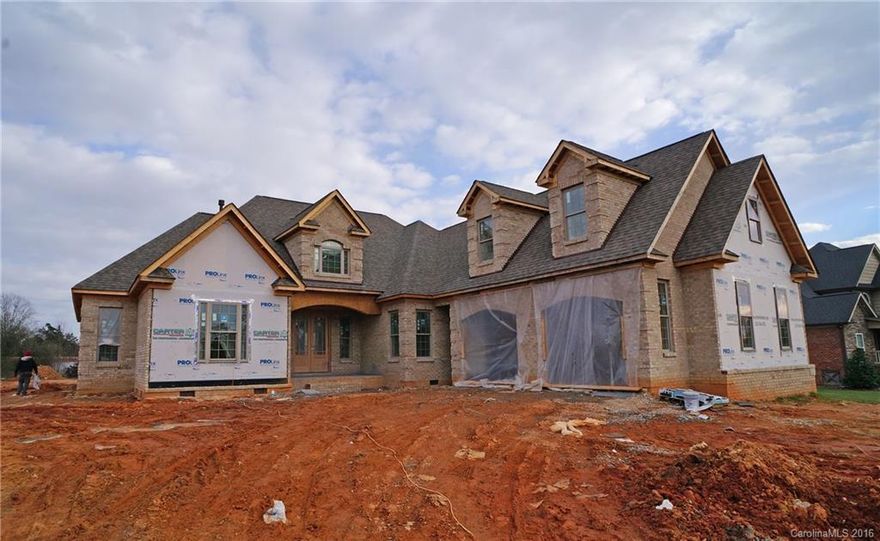 Breaking ground in August! A ranch with all bedrooms on the main and a large bonus room upstairs. The master en suite will have a tray ceiling, walk in closet and bath with separate tub and shower with granite and tile floors. The kitchen will have double ovens, granite counters, SS appliances, and HW floors. Breakfast nook and dining room. Vaulted ceiling living room with a gas fireplace and built in shelving. There are two bedrooms with and a shared bath. Office space. Covered porches.