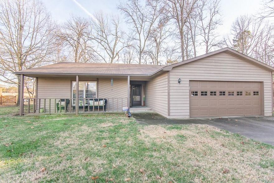 Charming front porch welcomes you to this immaculate ranch located on the golf course with a stunning view of the water! Beautifully updated with open floor plan concept. Huge breakfast bar, stainless steel appliances, butler's pantry with wine fridge, plenty of cabinet space, gas fireplace with stone surround and custom wood mantle. Step into the renovated master bathroom with custom tile shower. Expansive screened porch with sliding glass doors to back yard with trees (0.39 acres).