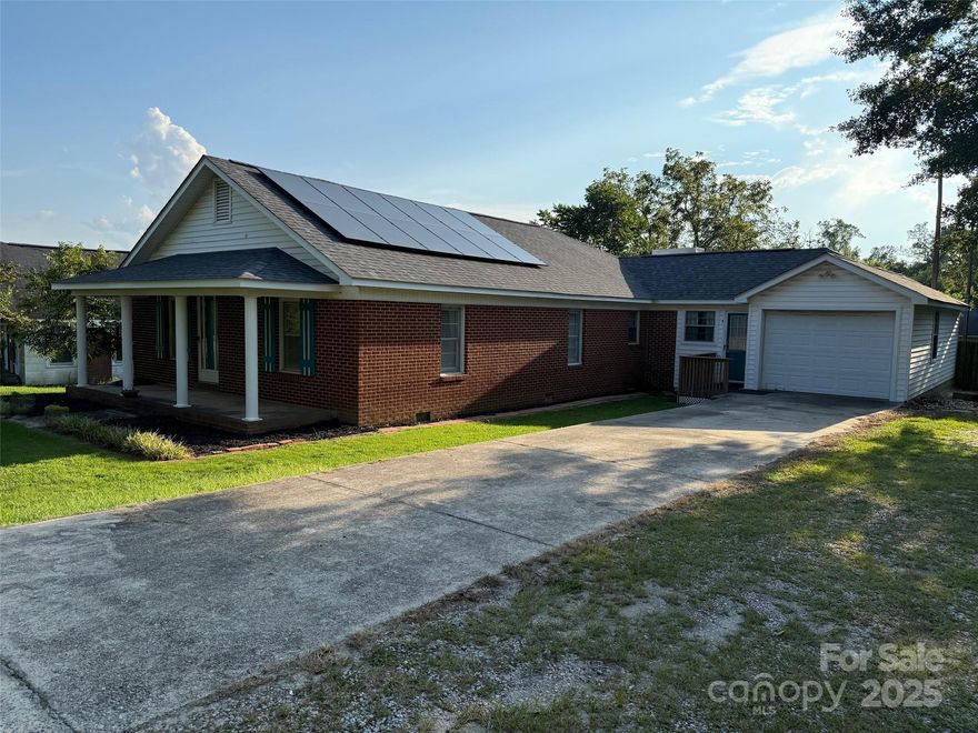 Really cute brick home w/ 3 bedr., 2 bath right off the By-Pass in Kershaw!  Roof is 1 yr. old, nice gas fireplace, spacious kitchen! Washer/Dryer convey.    BUT, the SHOP/ MAN-CAVE / GARAGE is the main feature of this home.  Located directly behind home, it's roomy, w/ an attic for storage & the back yard is completely fenced in for privacy.  If you're looking for a home that can pretty well 'check off your wants', schedule an aptm. to tour this one.  Home is near AJ High School, & Elementary school.  Near post office, grocery stores.  Call your favorite Realtor to schedule a showing!