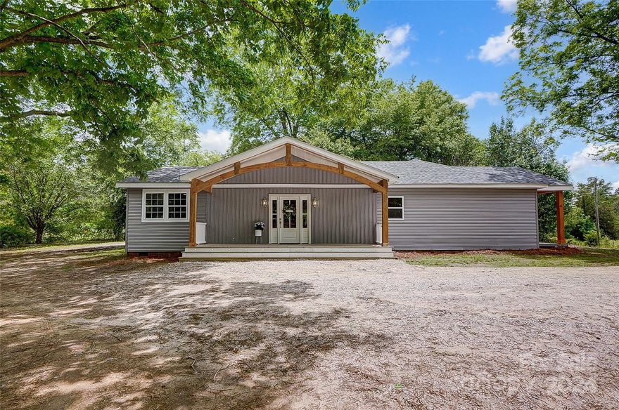 Introducing your dream home: a meticulously remodeled sanctuary nestled in the serene countryside, where privacy meets luxury. This stunning residence boasts a fresh modern design, featuring two exquisitely crafted custom bathrooms, each a testament to meticulous attention to detail and fine craftsmanship. Step inside and be greeted by the spacious elegance of three beautifully appointed bedrooms, offering both comfort and style for you and your loved ones. Luxurious vinyl plank (LVP) flooring flows throughout living areas and hallway. Adorned with gleaming quartz countertops and equipped with a sleek hood range, this culinary haven is sure to inspire your inner chef. Notable upgrades abound, including a brand-new roof, plumbing, and electrical systems, including a tankless water heater. Escape the confines of HOA restrictions and embrace the freedom of country living at its finest.