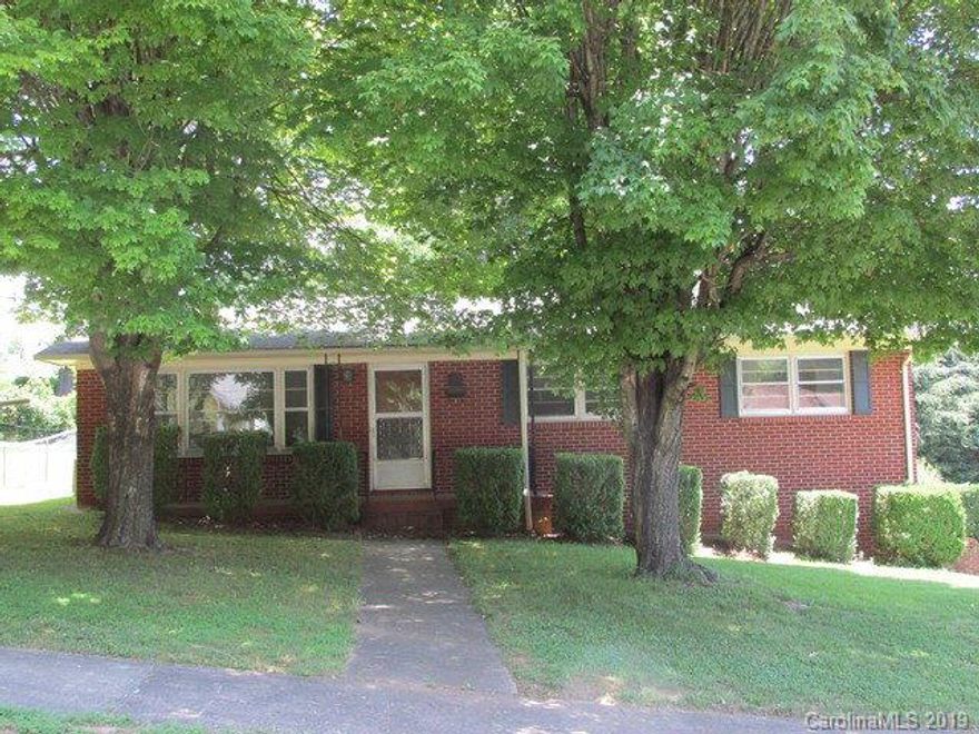 Charming brick ranch filled with lots of windows providing natural light with full basement, Large kitchen with plenty of cabinets, Dining Room or Den off kitchen, 3 bedrooms and one full bath all on main floor. Freshly painted interior. Gas heat. Hardwood floors under carpet per seller. Laundry on main and also in basement. Unfinished basement provides 2 car garage and plenty of storage area. Walk to downtown Morganton,school, Martha's Park.