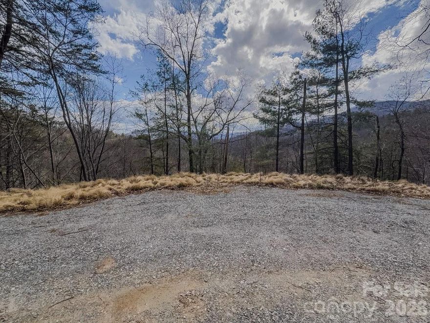 Build your dream mountain retreat on over 5 acres of unrestricted land just off Cove Creek, near Cataloochee Valley in the breathtaking Great Smoky Mountains National Park. This property offers the perfect blend of privacy, natural beauty, and convenience for those seeking a peaceful Western North Carolina lifestyle.
The current owner has already completed much of the initial groundwork to help bring your vision to life. The property includes a well permit, 3-bedroom septic permit, and a graded house pad with a gravel drive that leads you right to your future homesite.
Also on the property is an unpermitted shed that will convey with the sale—ideal for transforming into a cozy she shed, man cave, or shared hangout space. Let your imagination decide how best to use it.
Please note that the solar panels currently on the property will be removed by the seller prior to closing.
Don’t miss this opportunity to begin building the mountain lifestyle you’ve been dreaming about in the beautiful mountains of Western North Carolina.