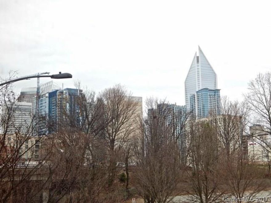 Two story condo fully furnished condo features concrete floors, ceilings, exposed brick and duct work. First floors has an open floor plan with kitchen and den. Second floor loft with spacious bedroom, large walk in closet, bath with shower. Views of uptown skyline, Panther stadium. Close walk to all uptown has to offer. Bars/dining on first floor of building as well.