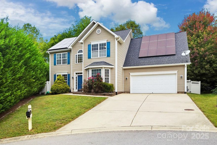 Go ahead and bring the moving van, because this well maintained home is ready and set to go. The two-story domicile is tucked on a cul-de-sac with a tall stand of conifer trees on one side for privacy and no neighbors behind. Upon entering the front door, you will notice the dedicated dining room and living room/study bracket either side of a gorgeous foyer entryway that leads back to an open concept den, kitchen and breakfast nook. The kitchen offers abundant counter space, cabinets and pantry. You'll also find your way from these open spaces out to the secluded back patio, attached two car garage and a discreet guest powder room between the kitchen and dining room. Upstairs boasts four bedrooms. The primary suite is quite large and provides ample closet space and a gorgeously updated private bathroom. A second bedroom also features direct bathroom access to the shared hall bath. The laundry is conveniently located in the hallway upstairs. Some of the best places Woodfin has to offer are within a one mile radius: Riverside Park, Taylor's wave (coming soon), High Five coffee and everything else located in the Mill at Riverside. Downtown Asheville is less than 5 miles away, but Riverside Rhapsody, Zillicoah brewing, Ginger's Revenge and French Broad Chocolate Factory are all found along the way: under 3 miles. Yes, the MSD treatment facility is also nearby and sometimes there is an odor, but it is not an "all day, everyday" occurence. The HOA fees are only $235 annually and restrictions are minimal. Solar panels have been paid off and greatly reduce the power bill. This excellent property has over 2600 SF of flexible, well-appointed interior space with just enough low-maintenance yard and outdoor space on a quarter acre lot. Don't overlook this hidden gem; come take a look for yourself.