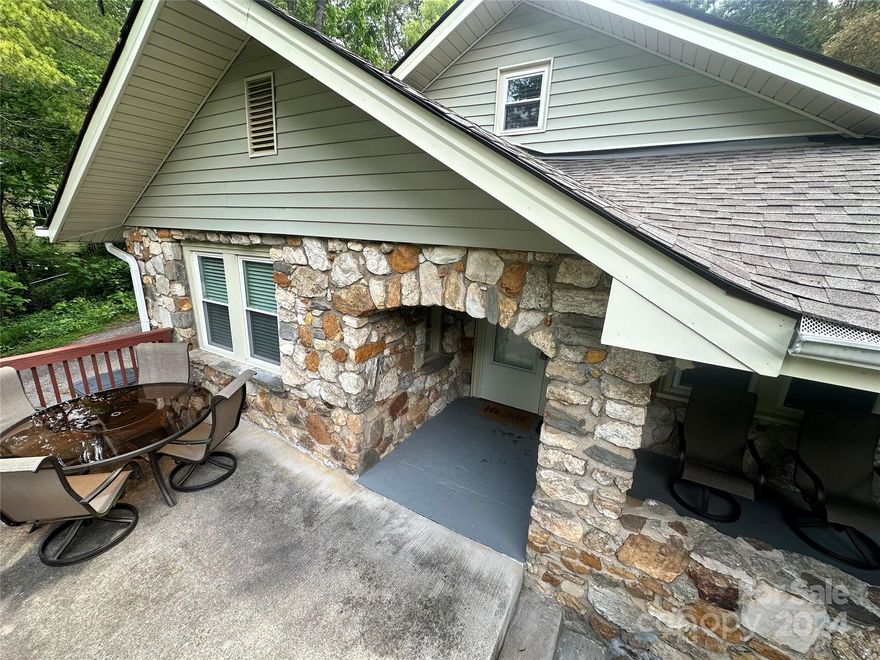Charming rock cottage nestled in a quiet and mature neighborhood, this home would make the perfect first-time home or a great rental property. There is lots of graveled parking in the back, and many recent updates have been made to the home. The furniture is negotiable. It is convenient to I-40, Biltmore Village, and downtown Asheville.