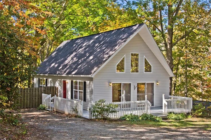 A-frame Chalet home on level lot with nice front yard surrounded by trees.Property at end of cul-de-sac in small Candler subdivision. Wide wrap-round deck for cookouts/entertaining with 2 fenced areas for pets. Storage area in crawl space. Full bath and walk in closet on second level. Under eave storage. Convenient to grocery, schools, and shopping with private setting.  Easy access to interstates from two directions. Great primary residence but feels like you're in a vacation retreat!