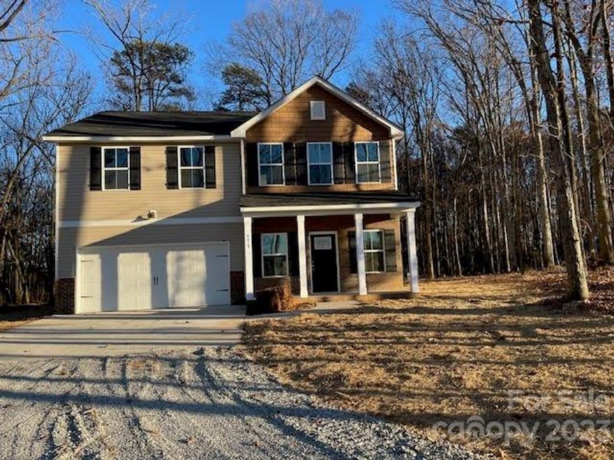 3.55 ACRES.  NEW CONSTRUCTION.   Nestled in the woods, you will find this newly constructed home offering lots of privacy.  Three and one-half acres allow plenty of space for enjoying outside.  Lots of windows allow the outside beauty to be appreciated inside.  Main level offers several areas to accommodate your family's lifestyle.  Entry is into a large family room.  Kitchen and dining area are open and spacious, allowing great flow for family and entertaining.  This area could also allow additional sitting area.  Kitchen features lots of cabinets, great workspace, an island, and a pantry.  Spacious primary bedroom, bath, and closet.  Two additional, good size, secondary bedrooms, an office, and laundry room are on the upper level.  Bring your rocking chairs for the front porch, your grill for the back patio, and start to enjoy country living.