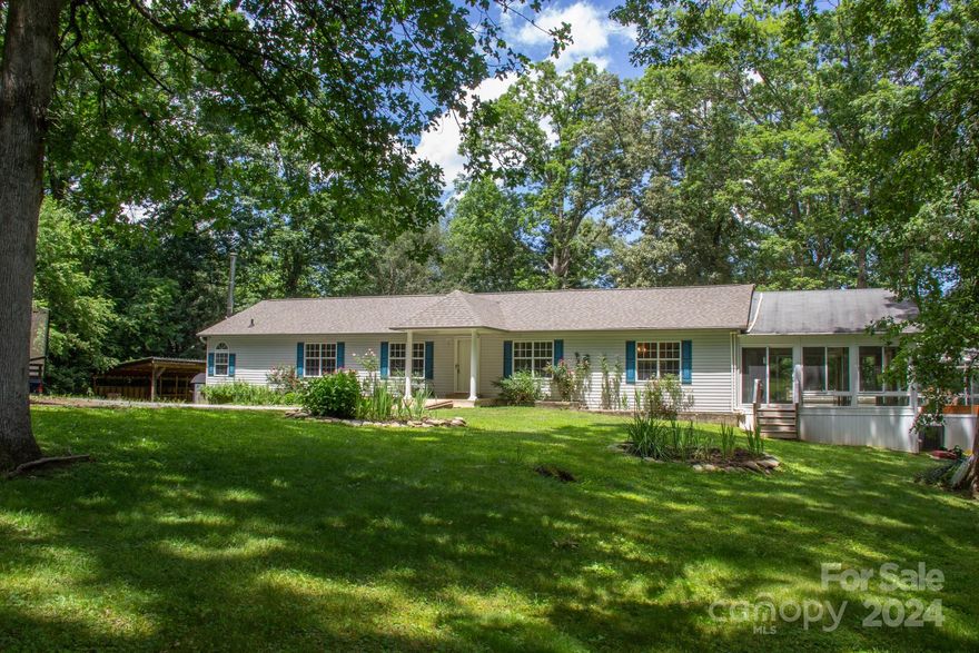 Bring the horses!  Private estate on 10.81 acres yet only minutes from all Mills River amenities such as grocery, restaurants and breweries.  This spacious 3BR/2BA on-frame modular has multiple additions, including a family room, four season room and sunroom with a lap pool.  Expansive kitchen with multiple dining area options.  The property consists of two parcels with walking trails, pet fencing, a personal recording studio/office and solar power set up.  Accommodations for your horses (or other livestock) include a barn, run-in shelter, workshop, hay storage and plenty of fenced pasture.  The property also features a private spring fed pond, wood-fired boiler and a gated entrance.  Fuel tanks on site for tractors and equipment can be left or removed, and other multi-purpose outbuildings add to the future options for this property.