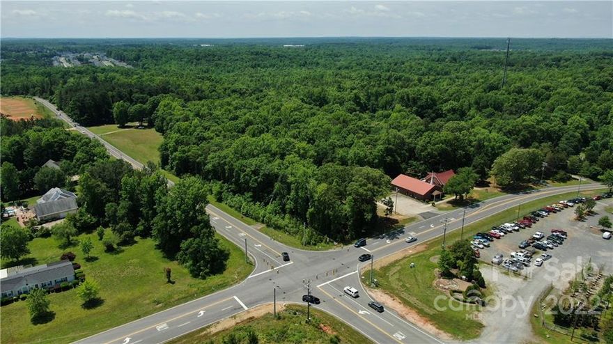 Great development potential in fast growing Indian Land. Currently zoned LDR. Corner property across Barberville Road is already zoned NB / Retail. Incredible 1089 feet road frontage on Harrisburg Road and 184 feet on Barberville Road. Hundreds of new homes in construction and development within 1-2 miles including Covington, Sugar Creek Townhomes and Patterson Preserve. Small house on property. Please do not walk property without appointment.