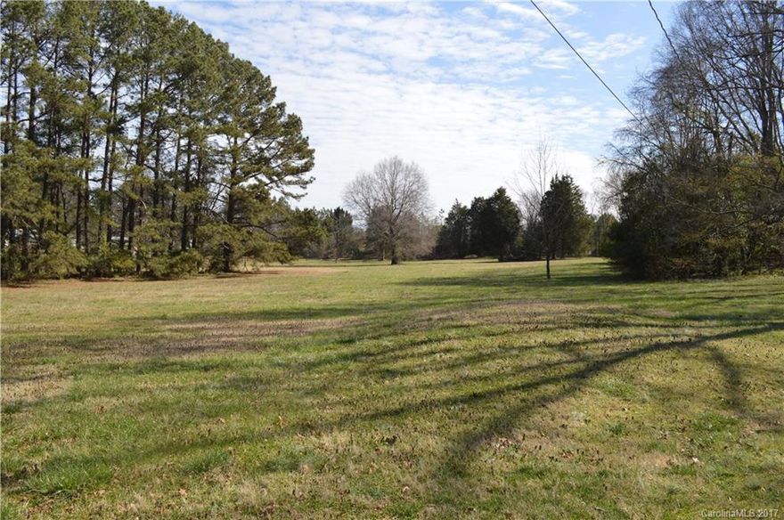 Tranquil setting for you to build your dream home. Almost 2 acres on level property. City water and sewer are available. Close to I-485, shops and restaurants. Great location!