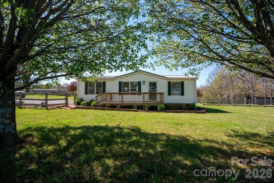 Imagine waking up to panoramic views in the peaceful rolling hills of Olin.  Situated on a 1.4 acre lot,  this 3 bedroom, 2 bathroom home offers the perfect blend of rural freedom and convenience located only about 15 minutes to downtown Statesville and 5 miles from I-77 making a Charlotte or Winston-Salem commute very manageable. Remodeled just 2 years ago, this home is impeccably clean, freshly painted and features a great floorplan.  The oversized lot offers massive potential and the unique ability to separate and sell a portion, creating a second buildable lot-or to add an ADU/second living quarters--perfect for a family compound.   Extra  features include a fenced in front yard, storage shed, well for irrigation (seller has not used) plenty of parking for RVs, boats or guests and a home warranty.  Whether you are looking for a private retreat or an investment opportunity, 889 Tabor Rd is a must-see!