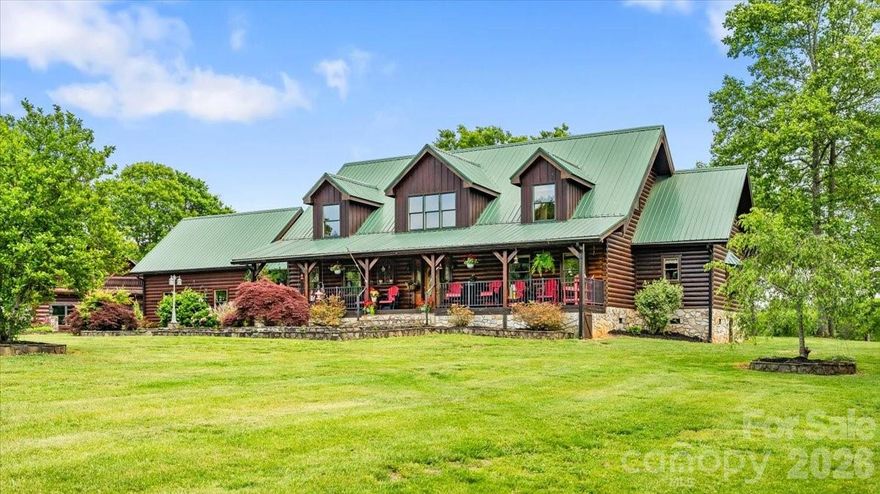 Extraordinary luxury log home estate situated on 16.02 private acres with pasture land, partial woods, over 1,388 feet of road frontage, and a prime corner parcel setting. Designed for both entertaining and peaceful country living, this one-of-a-kind property offers exceptional craftsmanship and resort-style amenities throughout.

The home welcomes you with a stunning entry foyer featuring a rosebud hardwood floor inlay and opens into a breathtaking great room with a soaring 24-foot timber ceiling, quad doors, and dramatic heavy timber staircase leading to the loft. The chef’s kitchen showcases custom knotty alder cabinetry, chiseled-edge leathered granite countertops, barnwood backsplash, breakfast nook with live bay window, and separate dining room.

The spacious primary suite features double barn doors opening to a 16x24 flex room and a luxurious ensuite with soaking tub, custom tile shower, double vanity, dressing vanity, and Brazilian rainforest granite countertops. Two upstairs bedroom suites each offer private full baths, while the main-level office can easily serve as a fourth bedroom.

Outdoor living is unmatched with 886 square feet of covered porches including a rocking chair front porch, rear porch, and flagstone breezeway connecting the home to the attached two-car garage. Enjoy the spectacular 18x32 lagoon-style in-ground pool with waterfall feature and custom timber pool house complete with full bath.
Additional improvements include a detached 28x32 log-finish garage with wood interior, balcony porch, upstairs bonus room, and 448 square feet of finished living space; a 24x36 playground; a 32x48 shop building; custom 24x36 picnic shelter with open grill, built-in cast iron smoker, outdoor fireplace, firepit, and half bath; 16x24 custom greenhouse; stocked 5/8-acre fishing pond; 3-stall horse barn with paddock and fenced area; plus a 32x48 pole shed. 

A truly remarkable luxury estate offering endless possibilities for recreation, entertaining, equestrian use, or private retreat living.

Brochure: https://online.flippingbook.com/view/79184671/