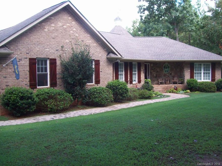 Beautiful 3BR/2.5BA located on 14+/- AC. Kitchen features granite and all SS appliances, 2 pantries, HW & tile, plantation shutters. Jetted tub, separate shower in main bath. Sun room w/hot tub, attached 2-car garage plus 1500+/-sqft detached garage/shop & office. 5 mins from I-77. Lot goes  back to where it has been cleared - same to your left if you are facing the house. Entire property has been marked with red paint on trees and blue paint is the back of property line. Adjacent lot included.