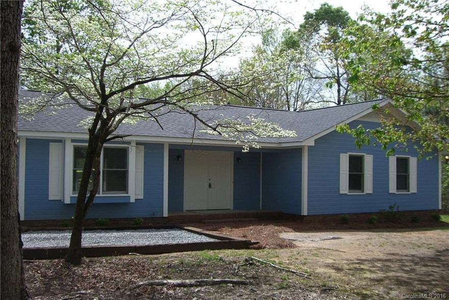 Picture perfect ranch on nice wooded lot. Completely remodeled & updated with new flooring, paint, & light fixtures throughout. New kitchen with dark wood cabinets, new countertops, new double stainless sink, & black appliances. Large great room with vaulted ceiling & wood burning fireplace. 3 good sized bedrooms with new carpet & ceiling fans. Updated baths with new vanities, mirrors, & lights. Newer roof. Beautiful country setting.