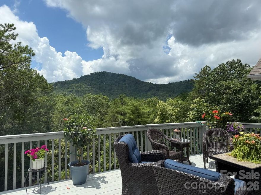 An expansive view of local mountains and an ideal location in the heart of Black Mountain.  All year around views are visible from the sunroom, living room, dining room, den, primary suite, and the large deck.  Feels secluded yet the Black Mountain golf course is just down the hill. 5 minutes to downtown Black Mountain, Lake Tomahawk, and Montreat. 

Features include complete remodeling of the 2 main level bathrooms, oak hardwood flooring covering the entire main level, kitchen cabinet lighting, front porch remodel, asphalt paving for the very large parking areas, and new, multi-tiered landscaping.  The large deck was repainted in the spring. The water heater and HVAC system were replaced in January, 2025 with the most efficient products available; a Heat Pump based water heater and a Mitsubished Hyper Heat System for heat and air.

Each floor level has its own entry door and an indoor privacy door is available between levels making it possible to rent one or two levels independently.