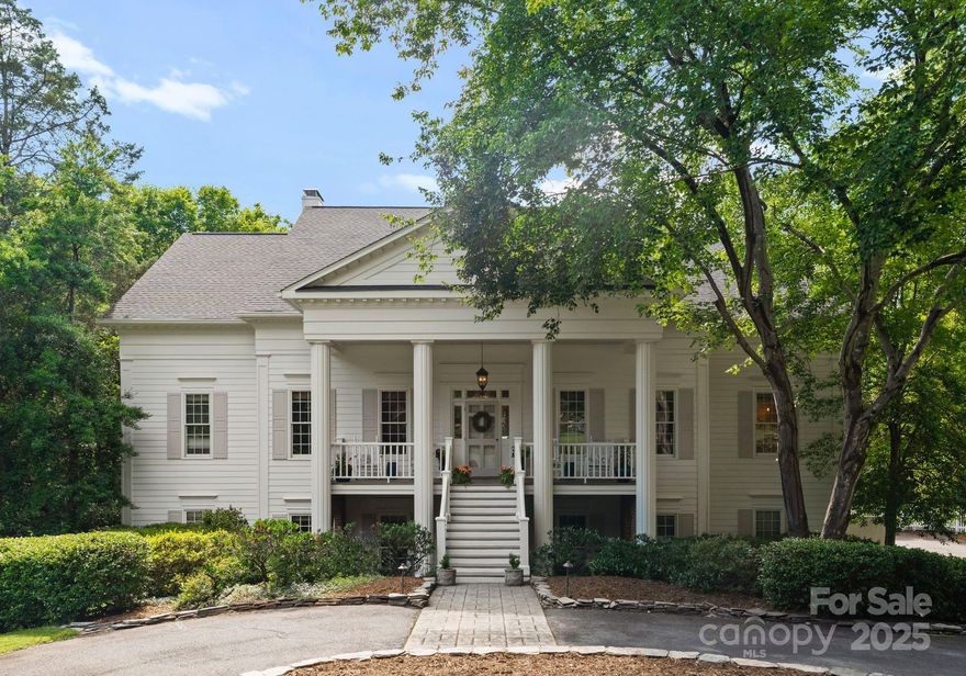 Nestled in the prestigious Hembstead community, this exquisite Southern estate offers timeless elegance and modern luxury. Set on a serene 0.89-acre cul-de-sac lot, the home welcomes with a classic rocking chair front porch. The main level boasts heavy millwork throughout the formal dining room and living room and main level den. French doors lead out to the screen porch. A chef’s dream kitchen features stunning porcelain countertops, custom cabinetry and double islands. The main-level primary suite offers a fireplace and tranquil retreat. Upstairs, you will find four spacious bedrooms with walk-in closets and two full baths. The finished lower level impresses with a stone fireplace in the family room, guest suite with full bath, bonus/rec room, wine cellar, and wet bar. Enjoy indoor-outdoor living on the screened porch or lower patio overlooking the expansive, private grounds. The attached two car garage has a workshop room as well as additional storage spaces.