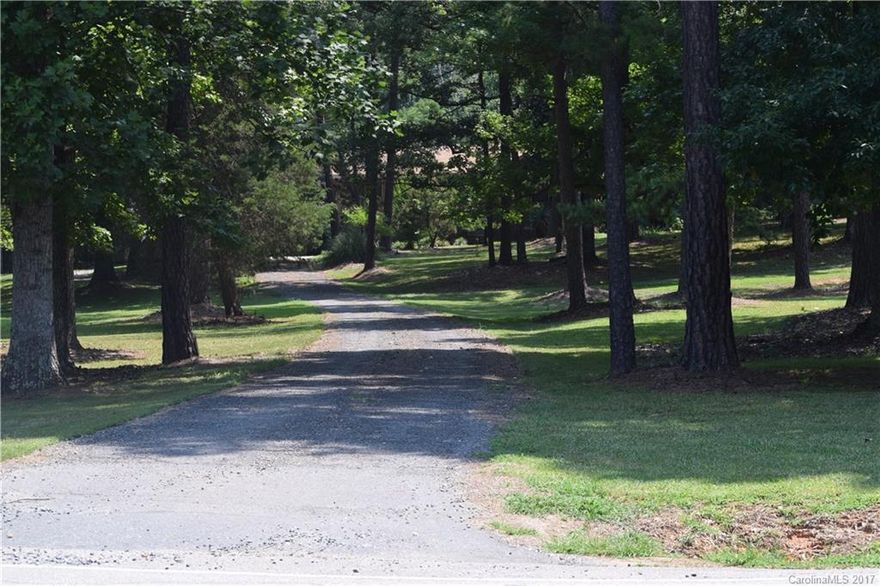 This is a rare opportunity to own 5 acres within minutes to Lake Wylie shopping and restaurants. This is a very private setting with plenty of land to store your toys or build a bigger home. Sale include both parcel ID 482-00-00-013 (2 acres) and 482-00-00-016 (3 acres). Home is very well maintained and has hardwoods under the carpet on the main floor.