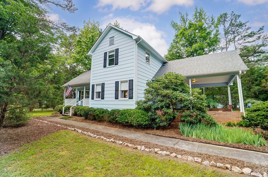 This well preserved home is located only 5 minutes from the heart of Waxhaw, boasting a deep front porch overlooking many trees & nature spaces. Step inside to a 2 story great room w/brick, wood burning fireplace for cozy evenings. Dining room is flooded w/natural light from the sliding doors opening onto a new deck for enjoying the expansive rear yard. Kitchen was recently updated with new quartz counters, subway backsplash, & stainless LG appliances. Primary bedroom on main with one walk in closet & one smaller closet. The ensuite full bath was recently updated to include granite counters, new sink, faucet, & light fixture. The upper floor is filled with charming spaces including two generous sized bedrooms & a loft. A large walk-in closet/playroom is off the loft. The carport could easily be enclosed to accommodate a two-car side loading garage. Deep lot also has an oversized outbuilding ready for a work from home office, she-shed or man cave. Too many features to list! Come see!