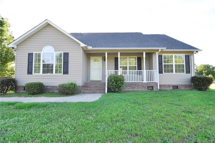 3 bedroom ranch home with split floor plan. Vaulted ceiling in living room. Storage building in rear. Large deck with lovely views of pond and green space. Country front porch