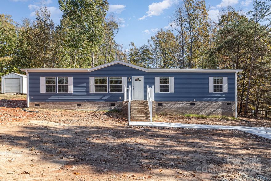 Back on the market no fault to sellers. Come discover your new charming 4-bedroom, 2-bathroom home nestled in the countryside, featuring a spacious yard with a deck for outdoor living. Inside, enjoy modern finishes and an open-concept layout, perfect for family gatherings and entertaining. A peaceful retreat with a perfect blend of comfort and style. If you are looking for something in a rural setting yet still within easy reach of amenities, this home combines the best of country living with the convenience of modern comfort. Seller concessions offered. One year warranty for structural, plumbing, electrical, and appliances.