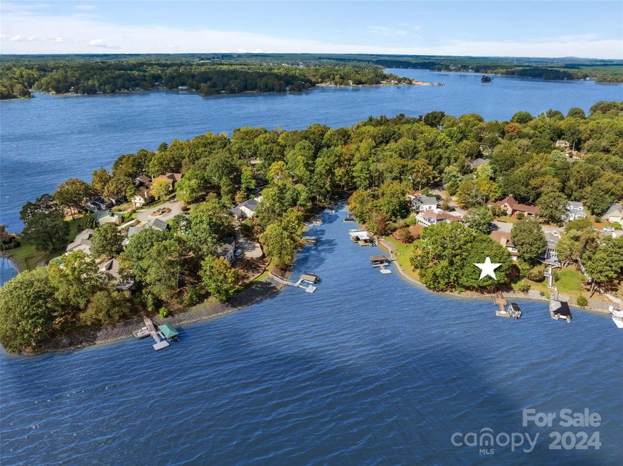 Waterfront Tega Cay on the Peninsula!  Great Cove on Lake Wylie.  Primary Bedroom on the Main, 2 bedrooms upstairs & Lower Level has 1 bedroom, full bath, Office & family/rec room.  Beautiful wood ceilings in main living areas & bedrooms! Two-story great room, stone fireplace & large windows across the back of the home for lake views. Kitchen remodeled with granite, tile backsplash, beautiful cabinetry, stainless appliances & gas range. Bathrooms remodeled with tile & walk-in showers. Hand-scraped wood vinyl flooring in main areas.   Expansive deck across the back of the house on the main floor. Lower level large patio & storage area. Stationary dock for seating, Floating dock & Boat lift. HVACs approx 1 yr old & 6 yrs old. Tankless hot water.  Tega Cay is a recreational city on Lake Wylie. Golf, tennis, pickleball, boat ramp, marina, beaches, walking trails, Tega Cay Beach Club & Pool, etc. Fort Mill Schools. ,Please verify with FMSD for current assignments.No HOA! Enjoy Lake Wylie!