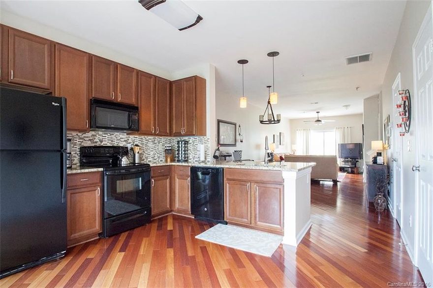 Upgraded unit available in fantastic NoDa location! Only a few blocks to the new Lynx Light Rail. Beautiful Brazillian Cherry hardwood floors throughout main level. Recent kitchen upgrades include an eat in bar as well as granite counter tops. Spacious bedroom and master bath. Seller will convey the washer and dryer to the buyers at no additional cost. This is one of the nicest units to ever hit the market in the The Renaissance. A must see! Exterior cosmetics being addressed/remedied by HOA.