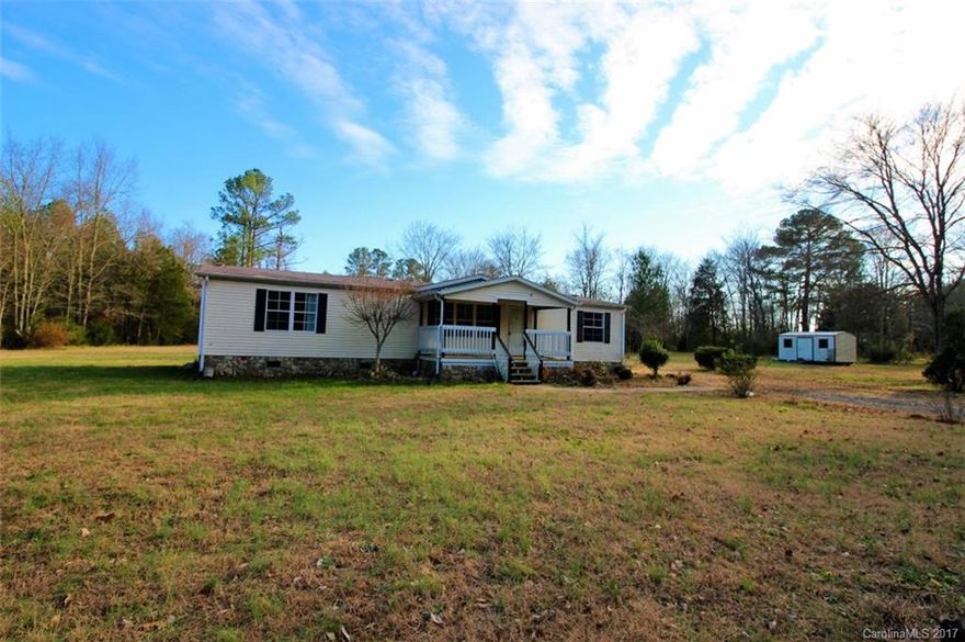 Welcome to Sharon, SC! This 3 bedroom/ 2 bath home is nestled on a private 6+ acre lot! Ready for some renovations and to make this place your own! The open floor plan leads you from the living room to the sunlight filled kitchen!  Large laundry room!  Master suite has walk in closet, big bathroom and sitting area!  The split bedroom plan has the additional bedrooms on the other side of the home.  Home is being sold as-is.