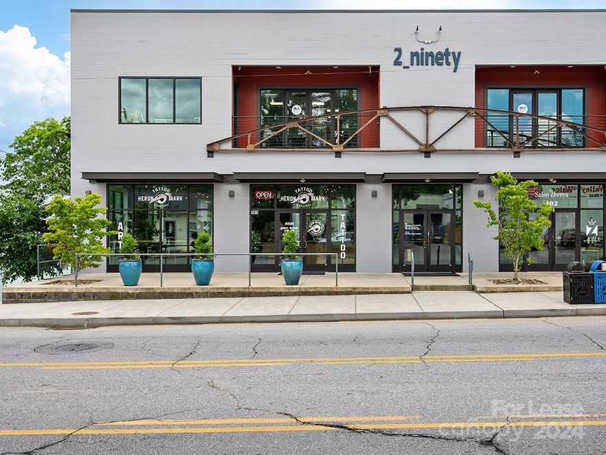 Located on the vibrant Beacham's Curve area of "East-West Asheville," 290 Haywood Road Unit 201 offers 697 square feet of office/loft space for a Tenant looking to join the west side's vibrant local scene. The space is located on the upper level of the building, with windows allowing for abundant natural light. The suite is comprised of a main office area and a bathroom. Accessible via the interior stairwell.
The building is incredibly well-located within 400 feet of I-240/I-26 Exit 2, and walkable to all of the vibrant amenities the Beacham's Curve area of "East-West Asheville" has to offer. Off-street parking is available behind the building via Wellington Street (open use), with numerous shops, restaurants, and breweries located within immediate walking distance. The galleries and greenways of the River Arts District are one mile down Haywood Road, and Downtown Asheville is two miles away.
