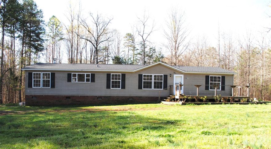 Great location for this fixer upper! Spacious double wide with 3 bedrooms and 2 baths on a nice acre lot. East Rowan Schools. New roof in 2022. Raised garden beds and outdoor shed. Sold AS-IS. Sellers will make no repairs.