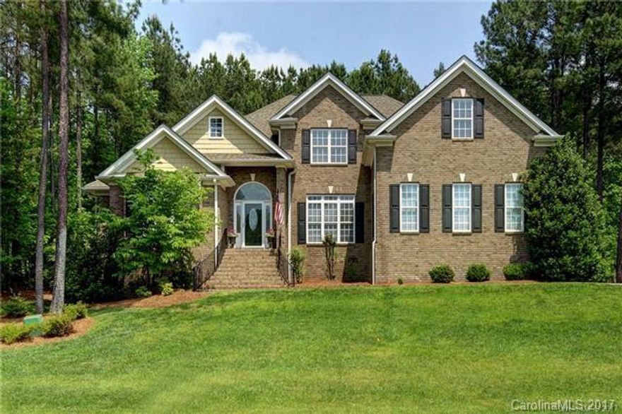 Custom Built Home!Great Curb Appeal! Spacious Open Floorplan! Stunning Gourmet kitchen w/breakfast area & adjoining den w/fireplace. Great room w/wall of windows & 2nd fireplace. Master on main w/upgraded appealing master bath & huge tile shower.Office & formal dining also on main.Upper level has 3 bedrooms, 1 w/ bath & 2 share jack & jill bath. Huge bonus/media room. Loads of closets. Backyard has spacious deck overlooking private tree lined property.Great Location! Great Schools! Welcome Home!