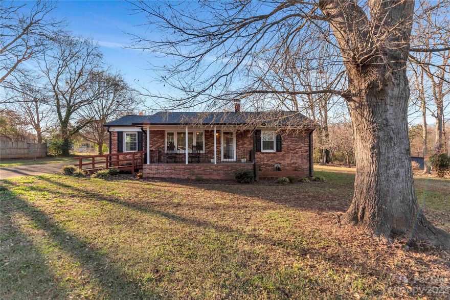 NEW PRICE!  This charming one-level, all-brick home features the perfect blend of comfort and potential, offering a tranquil retreat on over an acre of combined land.  The sale will include an adjacent 1/3 acre additional lot. Inside, you're greeted by the warmth of wood floors that gracefully flow throughout, accentuating the cozy ambiance of the home. The updated air conditioning unit ensures year-round comfort, while the oil furnace promises efficient heating during colder months. A detached all-brick garage is equipped with a convenient garage door opener.  Oversized, covered rocking chair front porch offers easy accessibility via the ramp—a thoughtful touch for easy entry. 
Don't miss the opportunity to make this delightful retreat your own—a place where comfort, potential, and serenity converge to create the perfect canvas for your dreams to flourish.