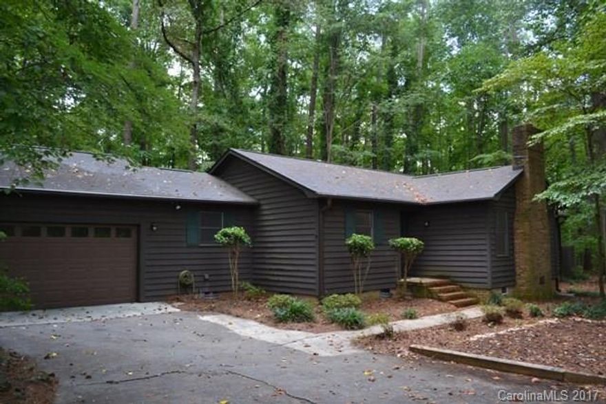 AS IS SALE. You will feel like you are far away in the mountains. Great kitchen for the cook in the family with lots of counter space & cabinets. Gorgeous stone fireplace in great room with gas logs & built-ins.  Sunken master with sitting room that would be great for an office or nursery. Private patio just off the sitting area where you can enjoy some quiet time. Walk-in closets in all bedrooms. Lots of time will be spent on the large screen porch & deck overlooking the wooded back yard.