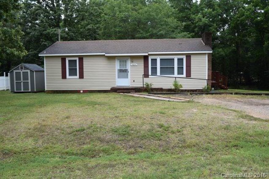 What a great home with a huge deck that was built in 2015!  This ranch home sits on half an acre, has two bedrooms and one updated bath.  Spacious great room with fireplace, great kitchen with large work island and an eating area.  Replacement windows throughout, small storage building will remain.  Cute as can be!