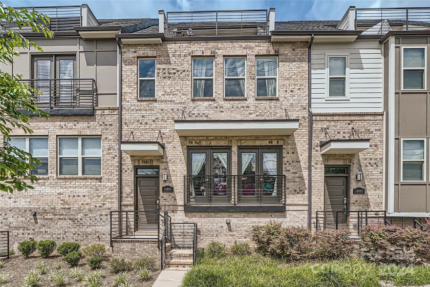 Fantastic four-story townhome in booming Belmont neighborhood! Walk out the front door one way to Uptown and the other way to Plaza Midwood. Stunning Charlotte city views from the rooftop terrace – best view in Central Point! 3 bedrooms (potential for 4th on lower level with half bath and capability to add shower), 3 full baths and 2 half baths in this spacious unit. Side-by-side attached two-car garage make this townhome wide and expansive! This was a Pulte model home so there are countless upgrades – full brick front, custom wainscoting, soft close cabinetry, Whirlpool appliances, split vanities & rain shower in primary, heated & cooled storage rooms, wood flooring on top floor and fiber optics/boosted WiFi which classify this as a true “smart home”. Main level features a private back porch, designated built in office space, open floor plan from kitchen to dining to living and all glass doors leading to Juliette balconies. True urban living in this fabulous Central Point Townhome!