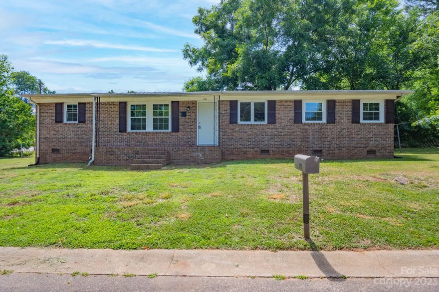 Updated Brick and Vinyl Ranch a with large side yard and corner lot. Plenty of room for a garage, building or pool. This home has a very functional layout with tons of storage, built in drawers in bedrooms. It boasts of new paint, windows, roof, kitchen cabinets and flooring.   A Brand New 2 1/2 gas pack, ductwork, boots and vents.  Additional special features include very large laundry room which could be used as a mud room, pantry or craft room.