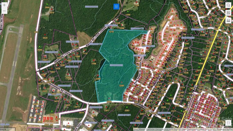 36.6 acres conveniently located minutes from I-77 and Lake Wylie access by Ebenezer Park. This sale is a portion of parcel number 590-00-00-002. It does NOT include the house at 3286 Homestead or 6 acres of land to be included with the house.