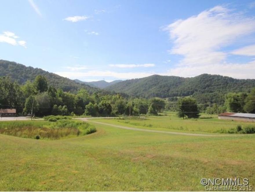 Will sell in 3 separate lots. Excellent location of level mountain acreage for building your dream home or subdivide. Views of Mt. Pisgah and within minutes of the Blue Ridge Parkway. This property has two small streams that run through the back of the land with a small island in between, step outside your home and enjoy fishing. Cute 1920 home is sold "as is". If you ever desired mountain living without the steepness of the mountains this is the property for you.