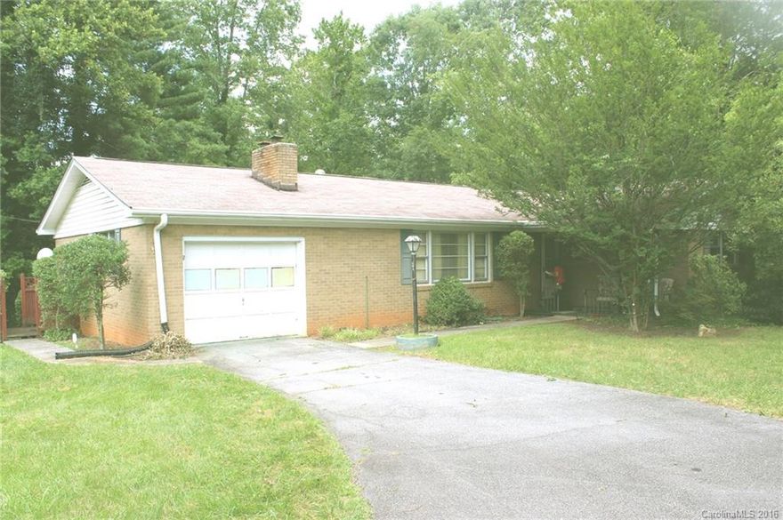 Neat brick ranch. 3 bedroom 2 bath home, with full basement. Relaxing screened porch plus open deck, and fireplace for those cold nights complete with heater insert.  Garage with extra storage. Attached carport on basement level. Convenient to banking, grocery, drug, and convenience stores.  Short distance to Hendersonville, but quiet.  Hardwood beneath carpet (Per Owner)