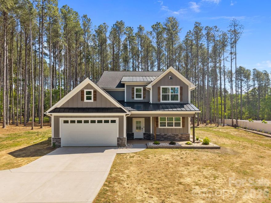 Beautiful, like-new home set on a sprawling 1-acre lot in the peaceful Homestead neighborhood. Meticulously maintained and thoughtfully designed, this property offers abundant features inside and out!

A deep, covered front porch welcomes you inside to a bright, open floor plan with 9-foot ceilings on both levels and ample natural light throughout. The main level features a versatile office or flex space, ideal for working from home or creating a quiet retreat.

The gorgeous kitchen is complete with granite countertops, a walk-in pantry, lots of cabinet space, and a bonus refrigerator that conveys with the home. Upstairs, all four bedrooms are generously sized, each with its own walk-in closet. The spacious primary suite includes a double vanity and an oversized walk-in closet, while the conveniently located upstairs laundry room (washer and dryer included) adds everyday ease.

Step outside to enjoy the oversized covered rear patio—perfect for relaxing or entertaining year-round. The expansive yard offers endless possibilities, including a private wooded section for exploring, along with outdoor string lights and a backyard playset that will remain with the property.

Additional highlights include a 50-amp EV charger in the garage, an extra-wide driveway with plenty of parking, and beautifully landscaped grounds featuring a variety of fruit trees and bushes.

With no HOA and a serene country setting just minutes from city conveniences, this home truly offers the best of both worlds.