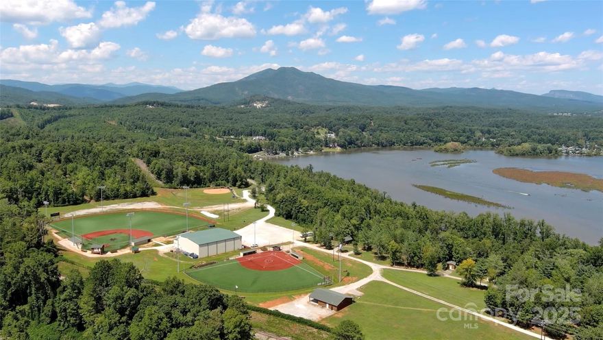 Big League Camp is a baseball/softball training & lodging facility on Lake James in Marion NC.  The property is approx. 165.88+/- acres w-waterfront access on Lake James & a private stocked pond. The facility features 3 outdoor fields(2 turf, 1 dirt) & an indoor training facility consisting of turf infield, batting cages, pitching mounds, virtual pitching machine, weight room, & classroom/video room. We also have 15 cabins & a covered picnic area. Our facility has been available for rental & has hosted tournaments, trainings, fundraisers, meet & greets, private birthday parties, team building camps, outdoor challenges, Little League, & hosted over 50 different college teams on our outdoor fields & indoor facility. Our facility offers endless possibilities w-additional wooded acreage w-paved/gated road to allow for expansion of the sports facility w-additional ballfields, housing subdivision, and/or could convert to a baseball academy/charter school, or offer other outdoor activities.