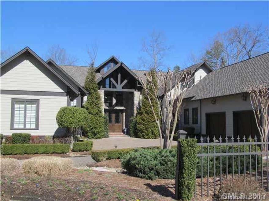 This former 'Homearama' home is sure to impress.  Backs up to the 1st fairway of the Palisades Golf Course.  Pool, two outdoor cooking areas, hot tub, theater, master on main, elevator, 2 kitchens, wine cellar, 2 laundry rooms, heated floors in master bath, screened porch and the list goes on.  This home is a master piece and will not disappoint!
